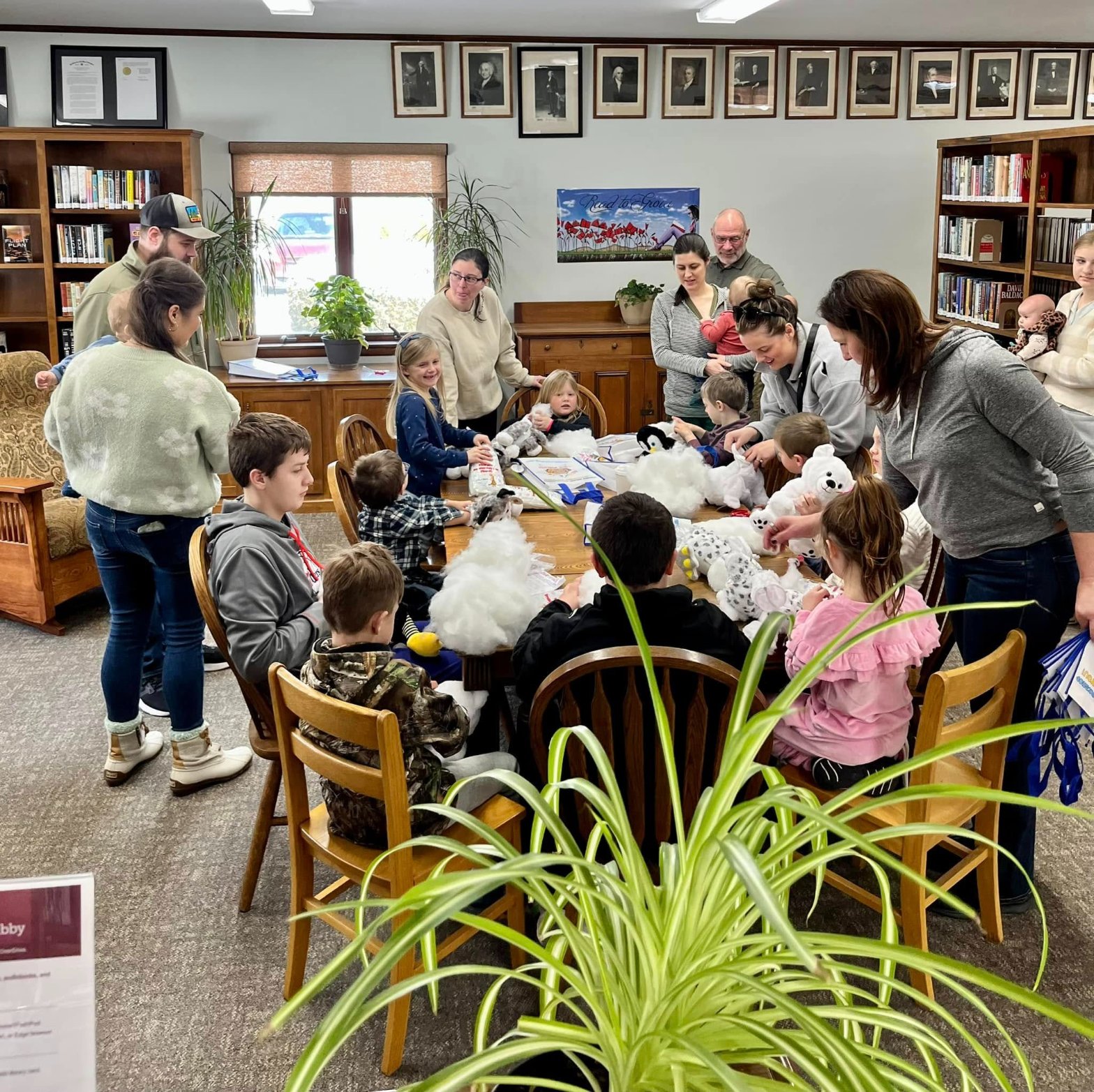Kids crafting their stuffed animals together at a library Noah's Ark Animal Workshop event